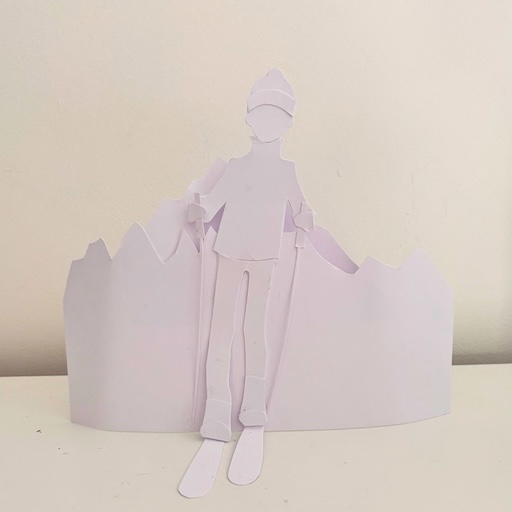 Silhouette de skieur en papier découpé blanc